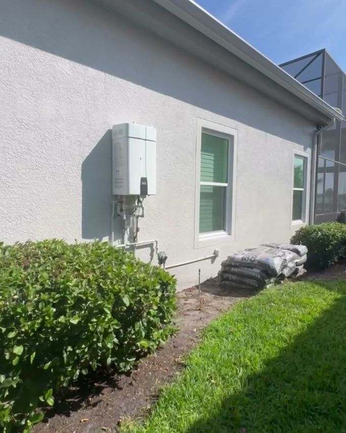 The same side wall after the repaint, in fresh light gray.