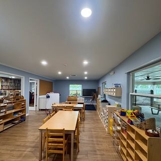 A long room with smooth, painted walls and ceiling.